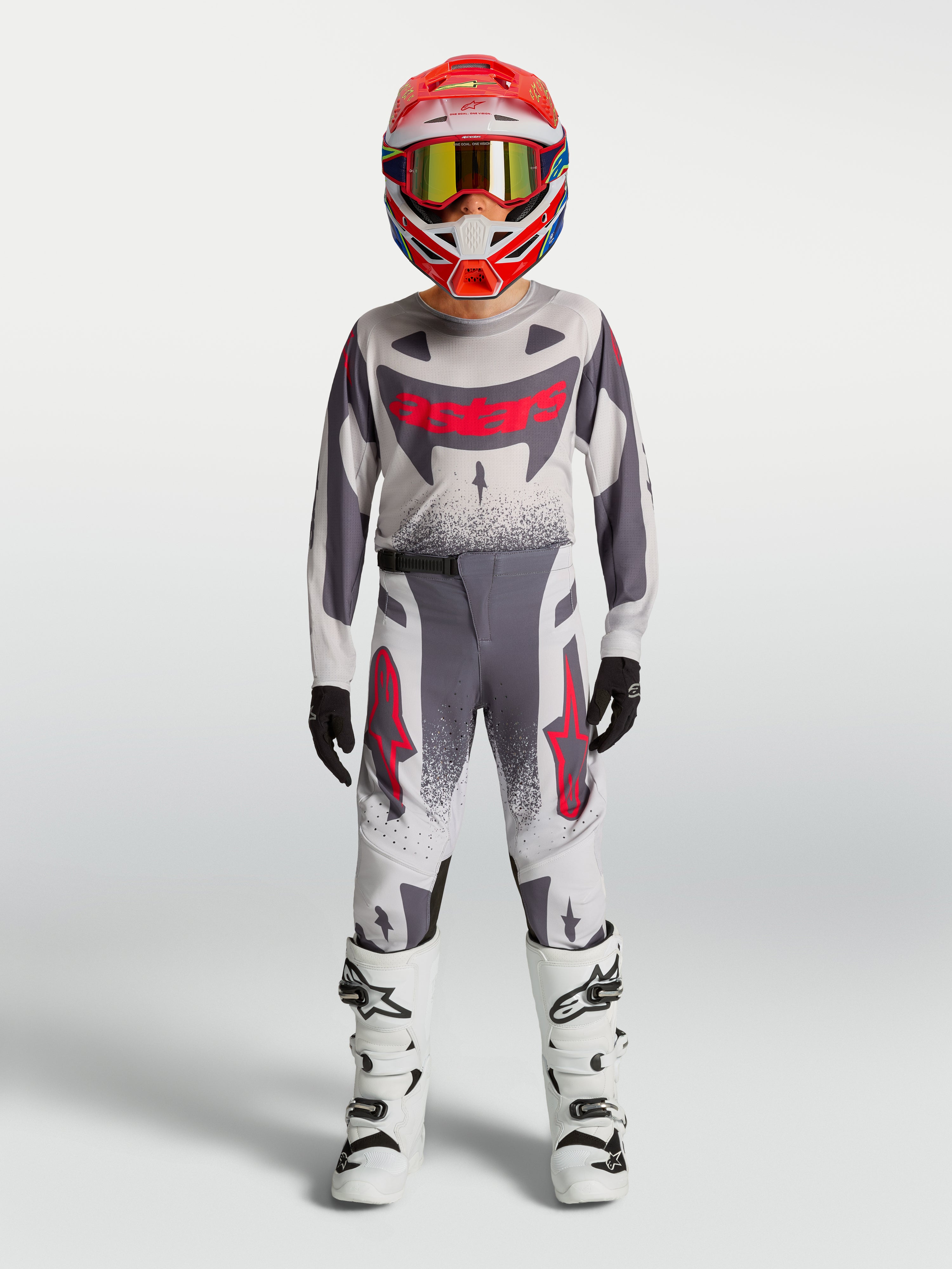 Alpinestars 2027 ungdom Supertech Swan tröja och gear set, grått och vitt motocross-set med röda detaljer.