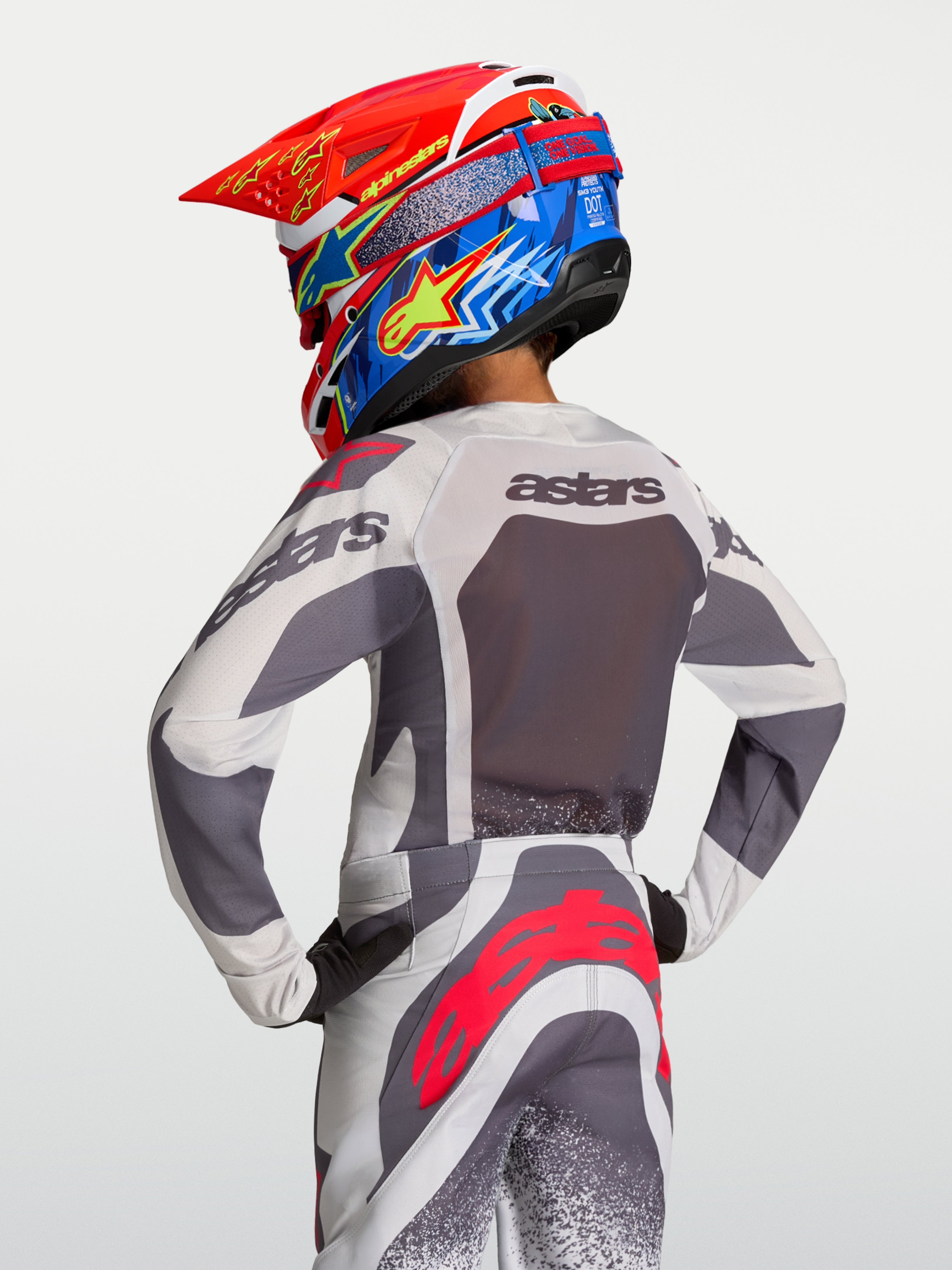 Alpinestars 2027 ungdom Supertech Swan tröja, grå och lila andningsbar motocrosströja i mesh, vy bakifrån på förare.
