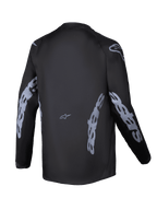 Alpinestars 2025 Youth Racer Graphite Jersey, Back View, Black and Gray, Long sleeve motocross jersey featuring gray Alpinestars branding on sleeves and sides, moisture-wicking fabric with a drop tail for off-road riding