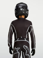 Alpinestars Youth Fluid Apex V2 Jersey, Black and Silver motocross top with ergonomic fit and extended rear coverage.