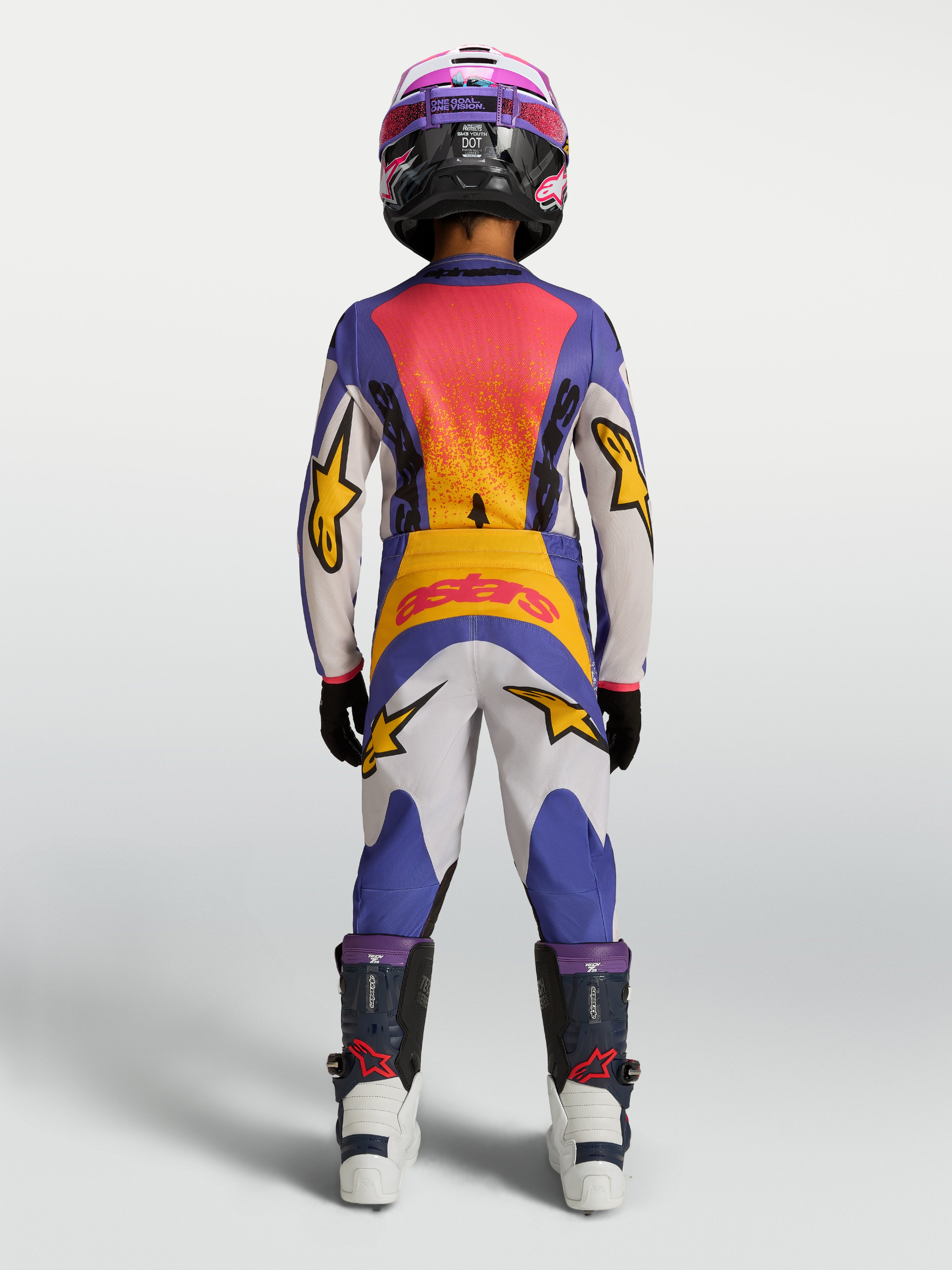 Alpinestars 2027 ungdom Fluid Drag tröja och utrustningsset, blå och guld motocrossutrustning sedd bakifrån.