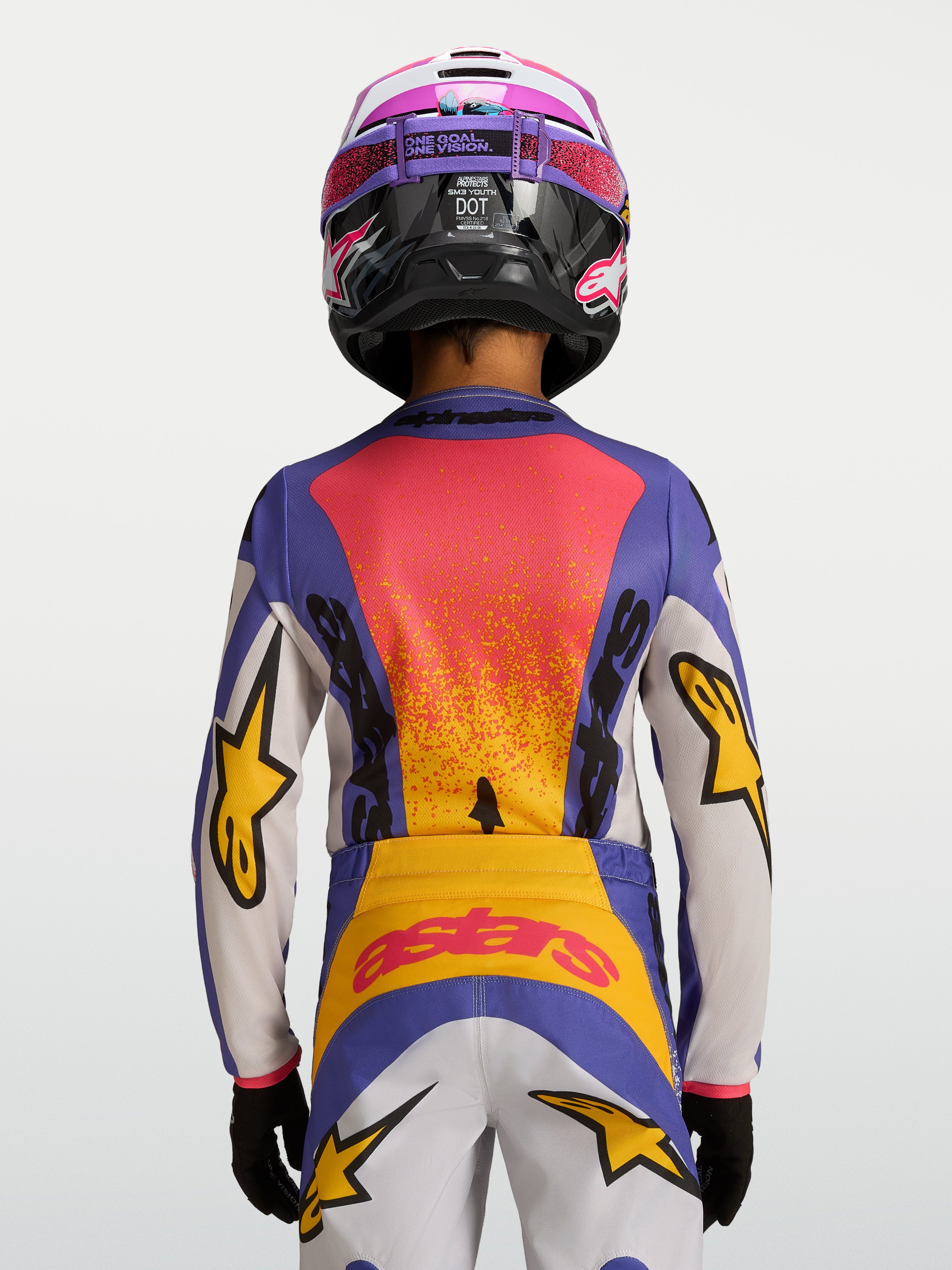 Alpinestars 2027 Ungdom Fluid Drag tröja, blå och gul motocrosströja, vy bakifrån med tävlingsinspirerad grafik.
