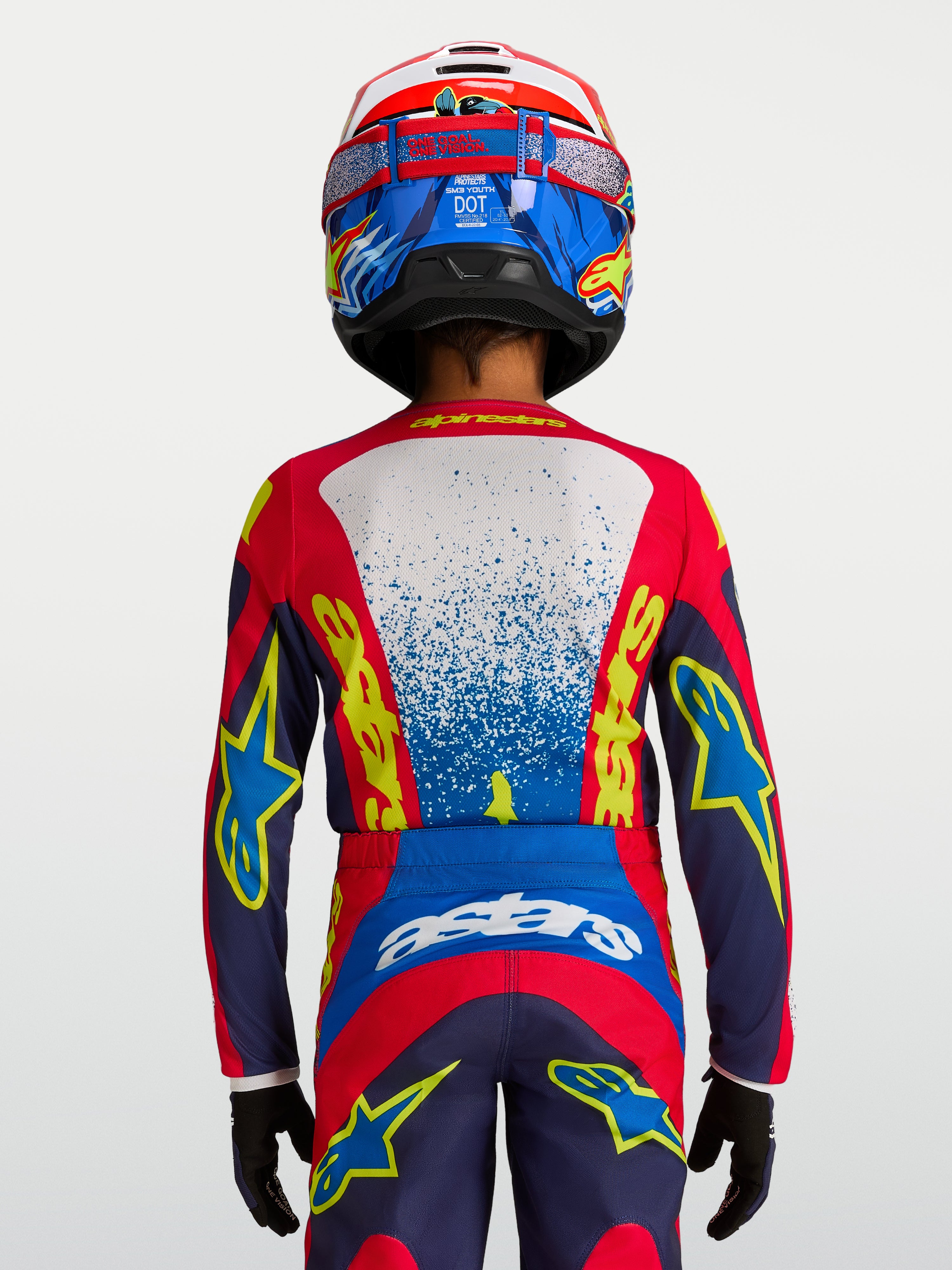 Alpinestars Fluid Drag ungdomströja i blått och rött, teknisk motocrosströja med ergonomisk passform för unga förare.