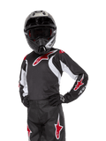 Youth 2024 Racer Lucent Jersey, motocrosströja, svart, vit och röd, bärs av en ung förare med en svart hjälm och matchande byxor, med röda stjärnlogotyper och vita grafiska accenter, prestandakläder för terrängkörning