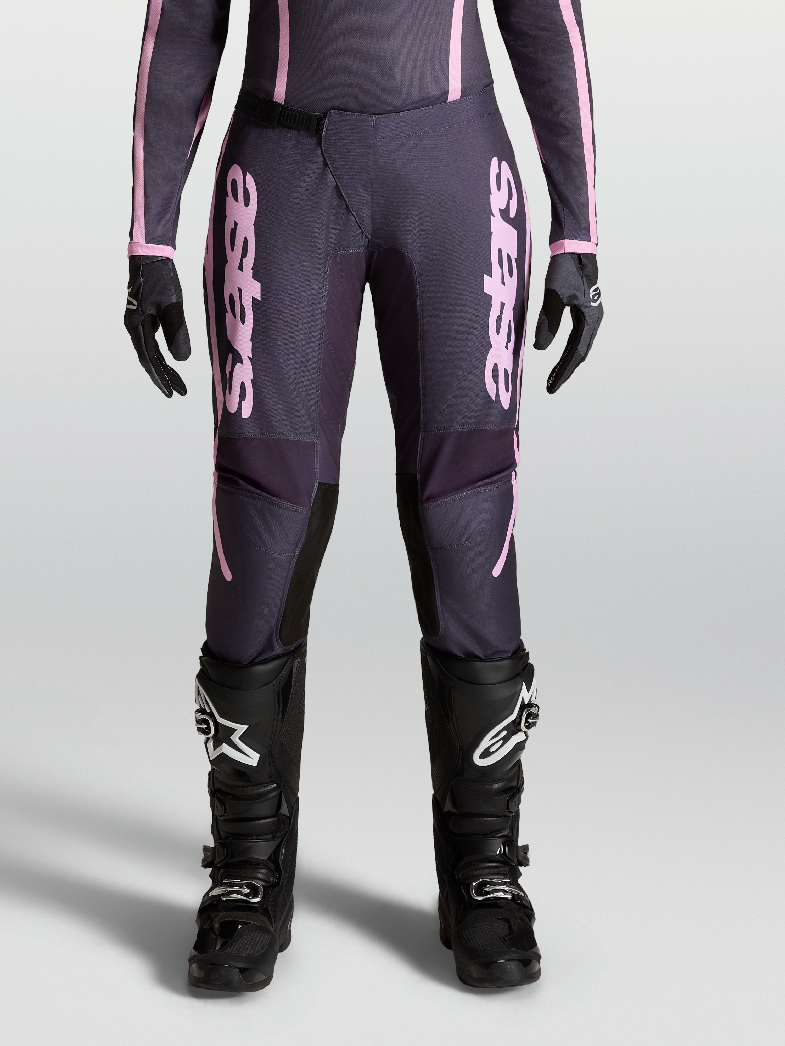Alpinestars Stella Fluid Apex V2 Pants, Women's Motocross Pants in Graystone and Old Pink with pre-curved leg construction and ratchet closure.
