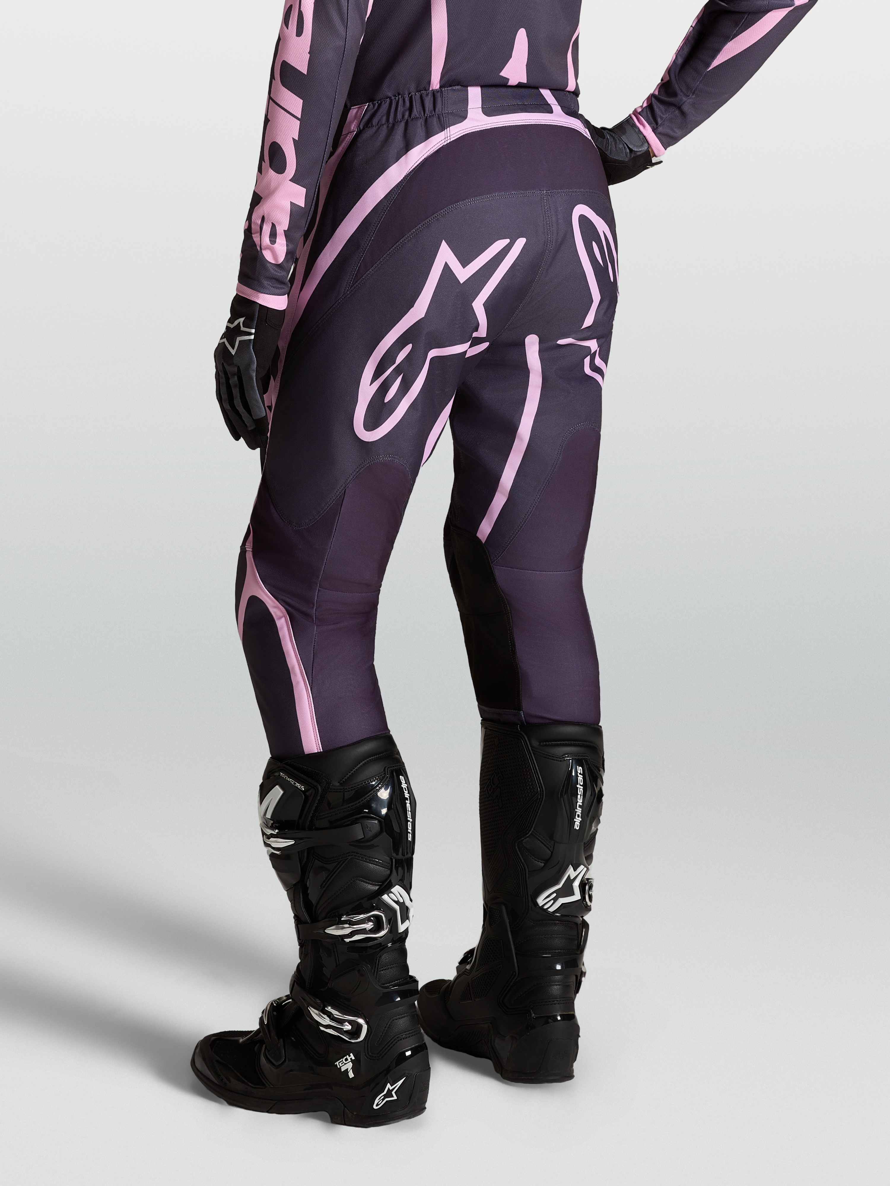 Alpinestars Stella Fluid Apex V2 Pants, Women's Motocross Pants in Graystone and Old Pink, paired with Tech 7 boots.