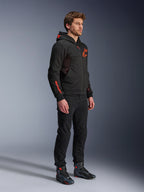 Alpinestars Chrome Air Sport Hoodie, Black Red Fluo, urban riding jacket with tech fleece, worn with black pants and motorcycle boots, featuring mesh ventilation panels and red fluorescent logos on the chest and sleeve.