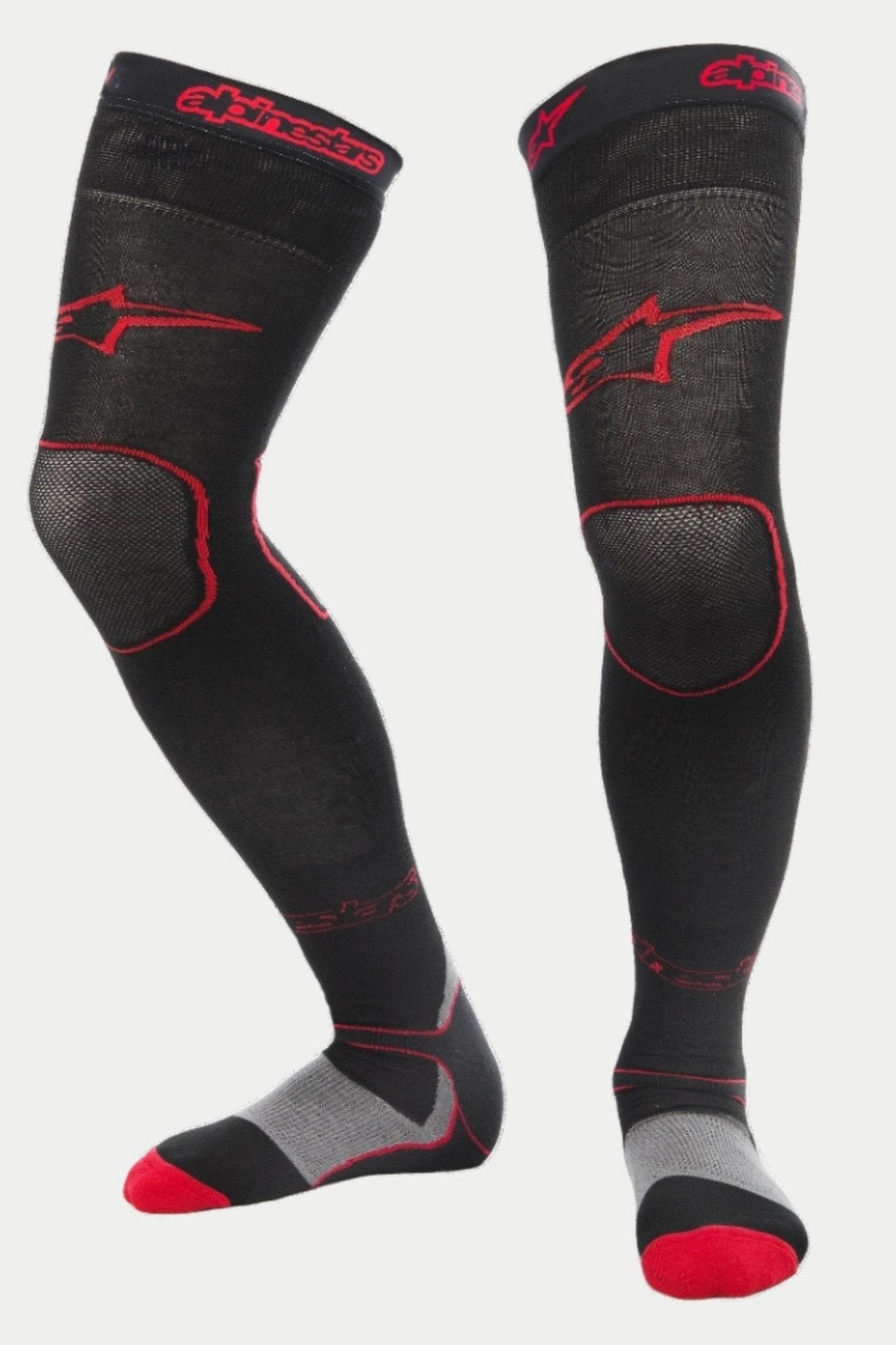 Alpinestars MX Long Tech Thick Socks, motocross-strumpor, svarta och röda med röda Alpinestars-logotyper på lår och mudd, grå häl och röda detaljer vid tårna, längd till mitten av låret med specialiserade mesh-zoner, tekniskt baslager för terrängkörning