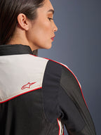 Alpinestars Stella T-Dyno WR Jacket in Black Ecru Bright Red, close-up of the shoulder and back, featuring ecru panels with red piping and a red Alpinestars star logo, women's textile motorcycle gear
