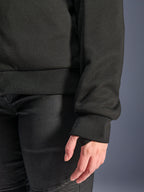 Alpinestars Stella Chrome V2 Sport Hoodie, Black, close-up of ribbed sleeve cuff with thumb hole and ribbed waist hem, tech fleece material for urban motorcycle riding