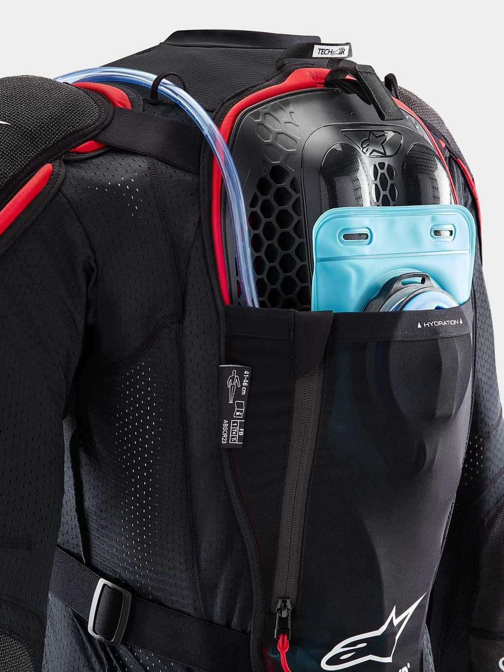 Alpinestars Tech-Air Off-Road System, off-road motorcycle airbag system, back view, black and red, showing integrated Nucleon CELL back protector and hydration bladder pocket