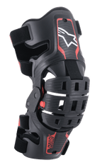 Alpinestars Youth Bionic 5S Knee Brace, motocross-knäskydd, svart och röd, med en vit stjärnlogotyp, ledat fyrpunktsgångjärnssystem, robust kompositram med justerbara remmar, designad för terrängkörning för ungdomar