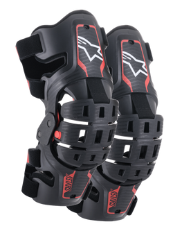 Alpinestars Youth Bionic 5S Knee Braces, Motocross Knee Protection, Black and Red, pair of protectors featuring a hybrid frame design with ventilated shells, white Astar logo on the upper section, red ASTARS branding on the lower section, and adjustable black straps for a secure fit.