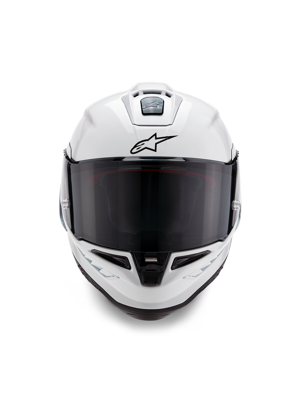 Alpinestars Supertech R10 Solid-hjälm, integralhjälm för racing, blankvit med svarta detaljer, vy framifrån som visar mörkt rökfärgat visir, aerodynamiskt ventilationssystem och svart Astars-logotyp