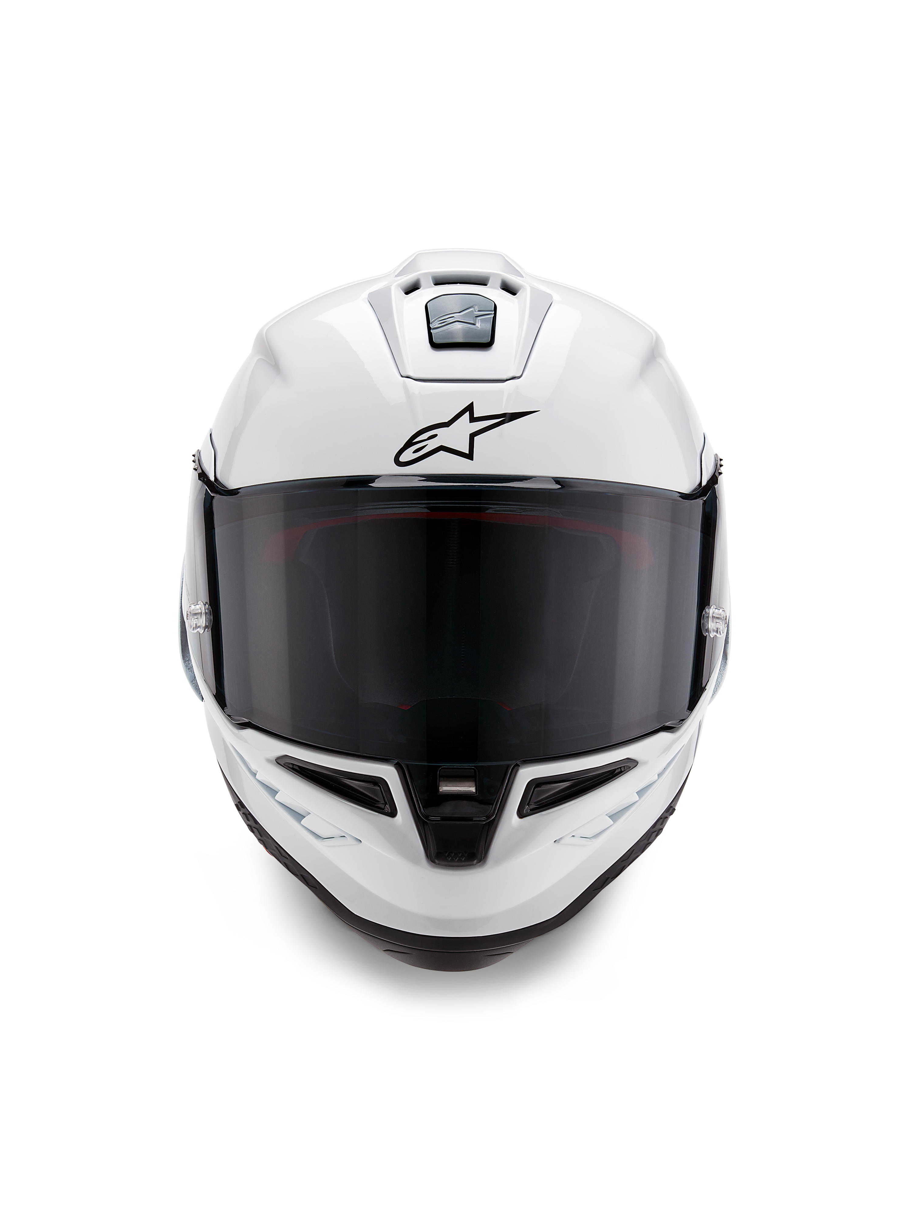 Alpinestars Supertech R10 Solid-hjälm, integralhjälm för racing, blankvit med svarta detaljer, vy framifrån som visar mörkt rökfärgat visir, aerodynamiskt ventilationssystem och svart Astars-logotyp