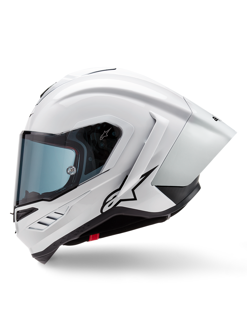 Alpinestars Supertech R10 Solid Hjälm, integralhjälm för racing, vit blank och svart matt, sidoprofil med integrerad aerodynamisk spoiler och tonat visir, med en svart Alpinestars stjärnlogotyp.