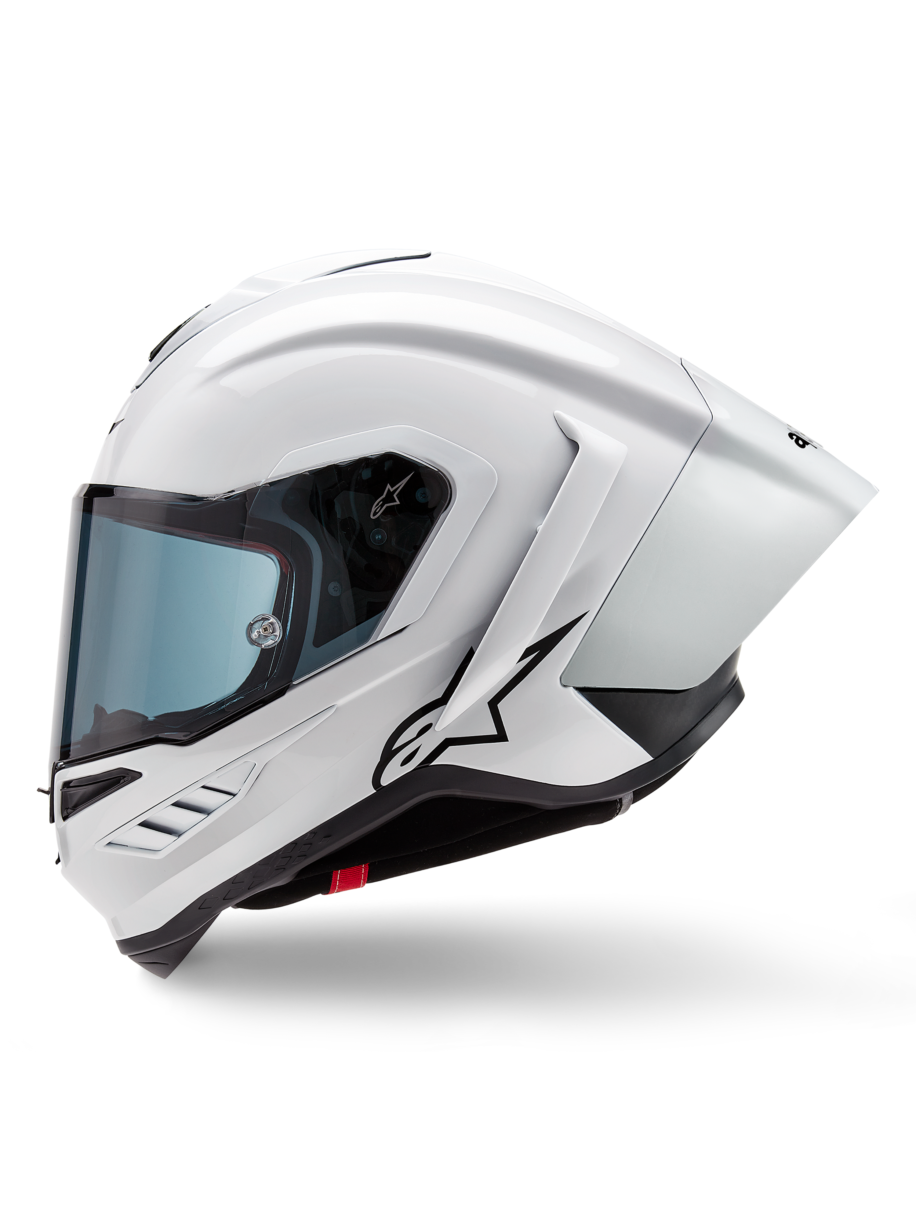 Alpinestars Supertech R10 Solid Hjälm, integralhjälm för racing, vit blank och svart matt, sidoprofil med integrerad aerodynamisk spoiler och tonat visir, med en svart Alpinestars stjärnlogotyp.