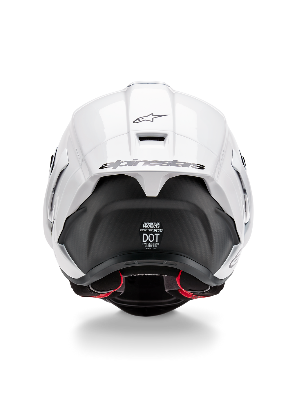 Alpinestars Supertech R10 Solid hjälm, vy bakifrån, blank vit ovansida med matt svart nedre del, aerodynamisk spoiler med svart Alpinestars-logotyp, synlig kolfiberstruktur och säkerhetscertifieringsdekaler