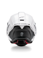 Alpinestars Supertech R10 Solid hjälm, vy bakifrån, blank vit ovansida med matt svart nedre del, aerodynamisk spoiler med svart Alpinestars-logotyp, synlig kolfiberstruktur och säkerhetscertifieringsdekaler