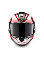 Alpinestars Supertech R10 Team-hjälm, sedd framifrån, svart kolfiber, röd och vit glansig finish, mörkt rökfärgat visir, vit Astar-logotyp i pannan, röd Alpinestars-logotyp på hakpartiet, aerodynamisk race-design med detaljerad grafik