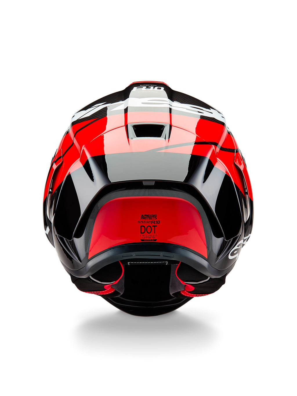 Alpinestars Supertech R10 Element-hjälm, sedd bakifrån, svart kolfiber med högblanka klarröda och vita detaljer, utrustad med aerodynamisk bakspoiler, ventilationsöppningar och DOT-certifieringsetikett, strömlinjeformad racinginspirerad design med kolfiberdetaljer