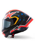 Alpinestars Supertech R10 Miller Limited Edition Helmet, side profile, Carbon Red Matt finish with visible carbon fiber weave, featuring red and white lightning graphics, blue stars on the rear, yellow accents around the visor, and white Alpinestars logo, high-performance racing motorcycle helmet