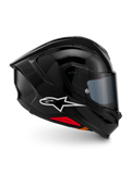 Alpinestars S-R7 Solid hjälm, integralhjälm för motorcykel, blanksvart, profilvy med vit A-star-logotyp, strömlinjeformat aerodynamiskt skal med integrerad spoiler och röda detaljer vid basen, designad för racing och sportprestanda.
