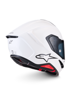 Alpinestars S-R7 Solid hjälm ECE 22.06, vit glansig helhjälm för motorcykelracing, sidobakprofil med aerodynamiskt kolfiberskal, svart A-star logotyp och certifieringsdetaljer