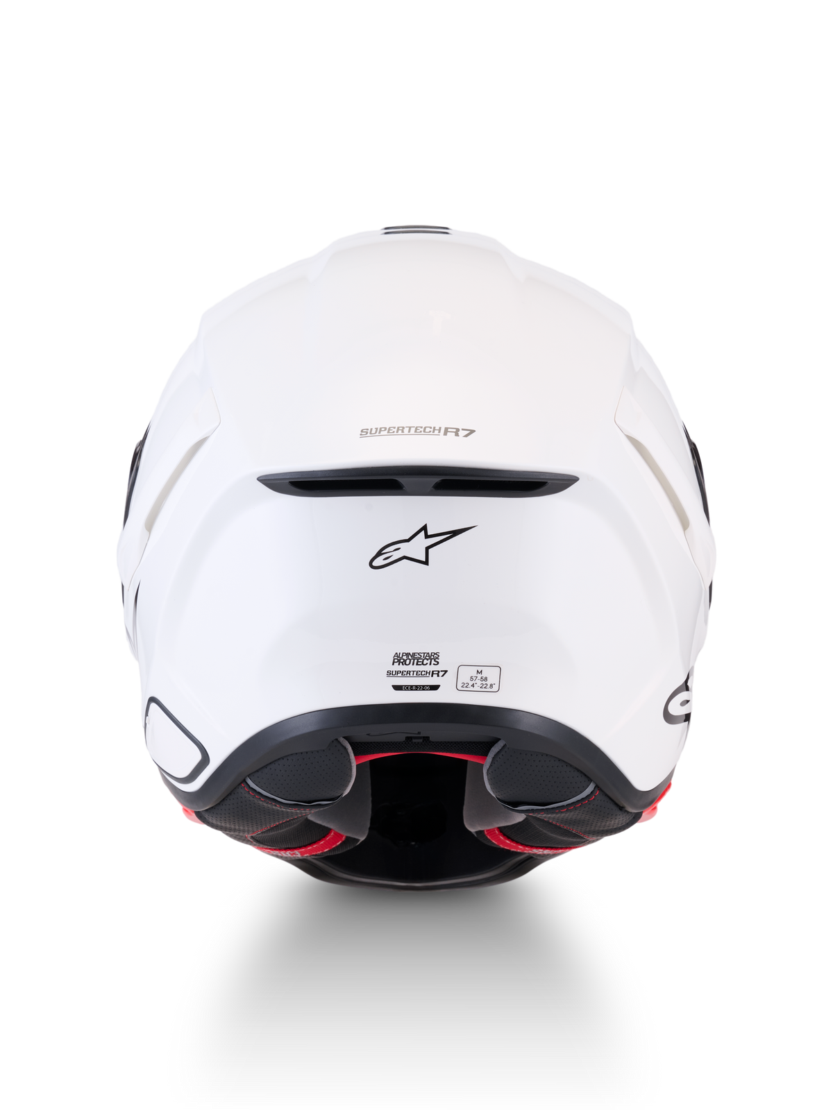 Alpinestars Supertech R7 Solid hjälm, vit motorcykelhjälm för landsväg, vy bakifrån som visar kolfiberkompositkonstruktion, ventilationsutblås, A-star-logotyp och ECE 22.06-certifieringsetikett