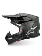 Alpinestars Supertech M10 Fame hjälm, svart motocrosshjälm i kolfiber med silverlogotyp, ECE 22.06-certifierad.