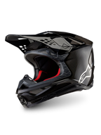 Alpinestars Supertech M10 Fame motocrosshjälm i matt och glansig svart kolfiber med vit logotyp, CE-certifierad.