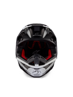 Alpinestars Supertech M10 Ampress Helmet, Motocross Helmet, Black and White Matte, front view with red interior lining, aerodynamic shell featuring ventilation ports and Alpinestars logo