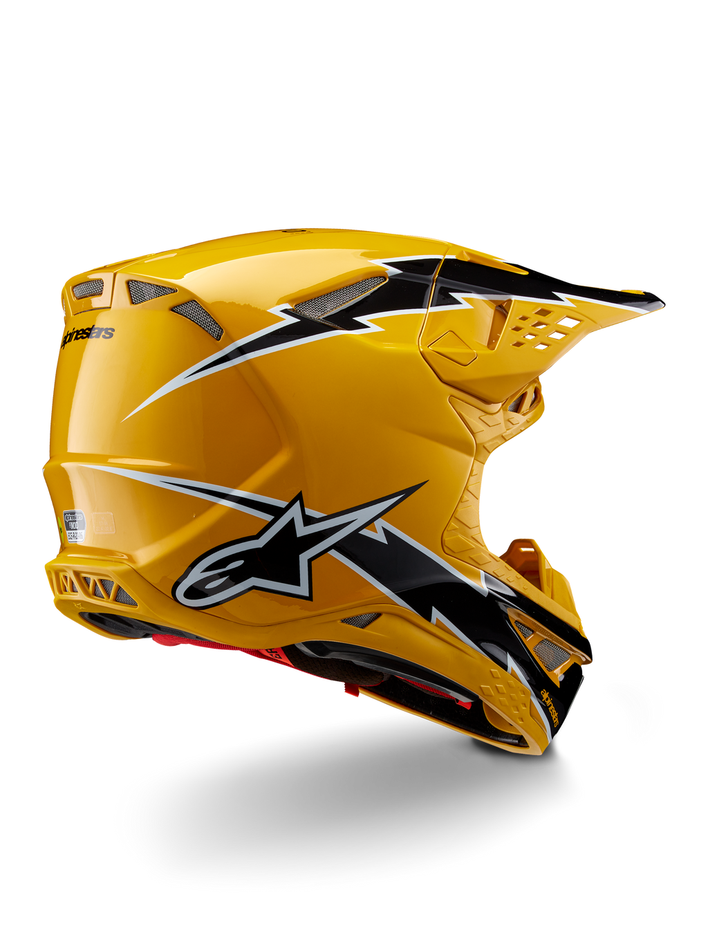 Alpinestars Supertech M10 Ampress Helmet, Motocross Helmet, Black Yellow Glossy, featuring a high-gloss yellow finish with black and white lightning-style graphics, rear three-quarter view showing aerodynamic shell and integrated ventilation ports.