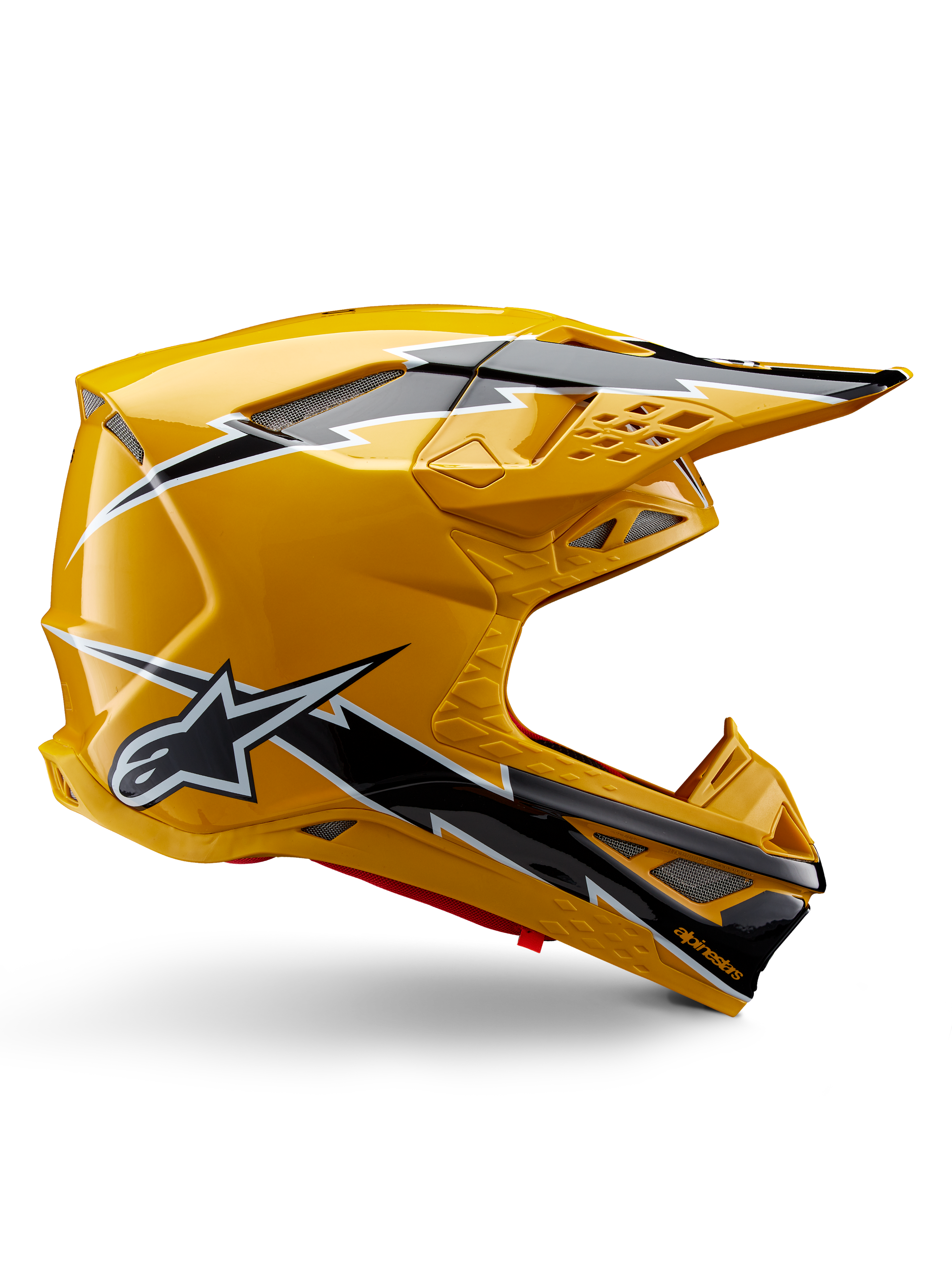 Alpinestars Supertech M10 Ampress hjälm, motocrosshjälm, glansig svart och gul, sidoprofil som visar kraftfull svart och vit blixtgrafik, Alpinestars stjärnlogotyp, aerodynamisk design med integrerade ventilationsöppningar och justerbart visir.