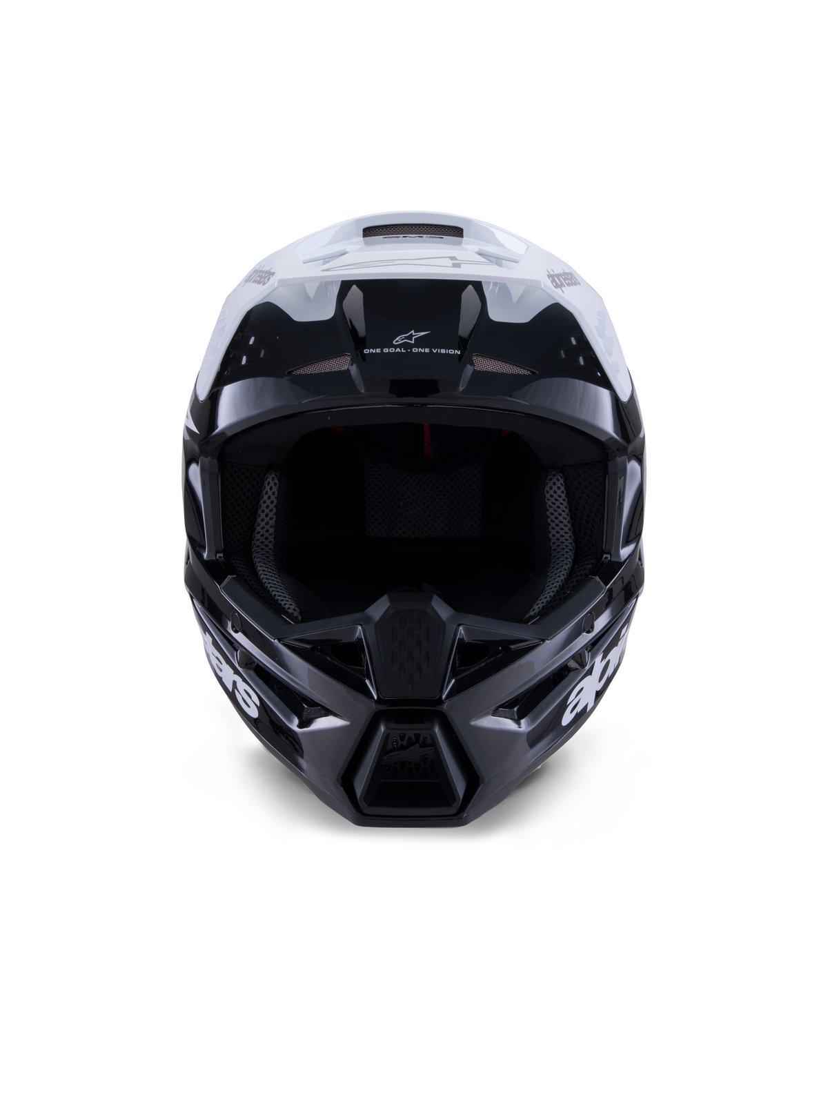 Alpinestars S-M3 Radium hjälm, motocrosshjälm, blank svart, vit och grå, vy framifrån, med en aggressiv skaldesign, vitt visir, svart hakskydd och nätfodrade ventilationsöppningar.