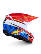 Alpinestars SM3 Falcon hjälm ECE06, röd och blå motocrosshjälm med gula stjärnor och grafik, vit bas, aerodynamisk off-road-design, ECE 2206-certifierad.