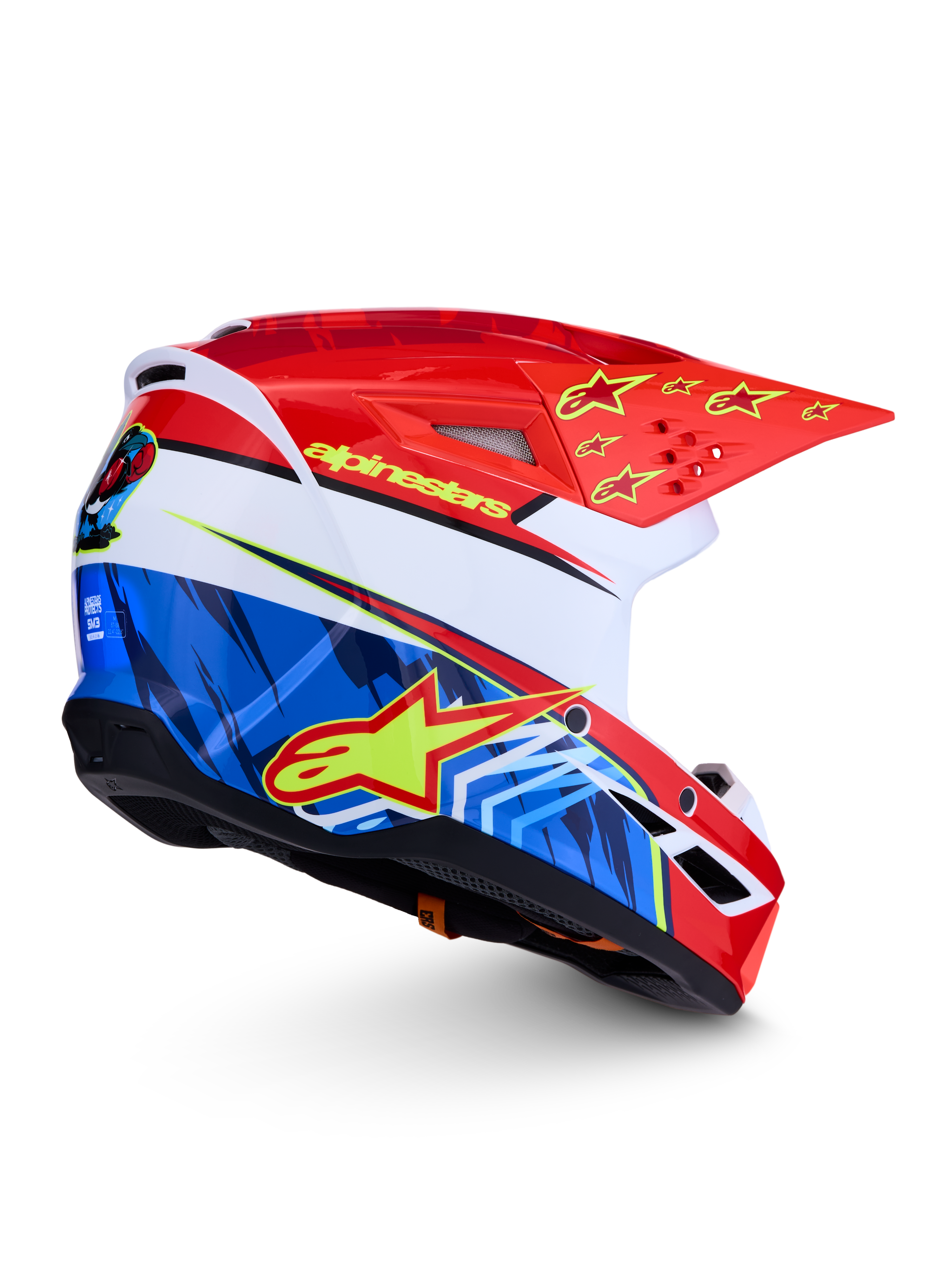 Alpinestars SM3 Falcon hjälm ECE06, röd och blå motocrosshjälm med gula stjärnor och grafik, vit bas, aerodynamisk off-road-design, ECE 2206-certifierad.