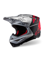 Alpinestars Supertech M10 Flood ECE 22.06 Helmet, Motocross Helmet, Silver Black and Orange Fluo, matte and glossy finish, featuring a sleek carbon shell with bold Alpinestars branding and multiple ventilation ports