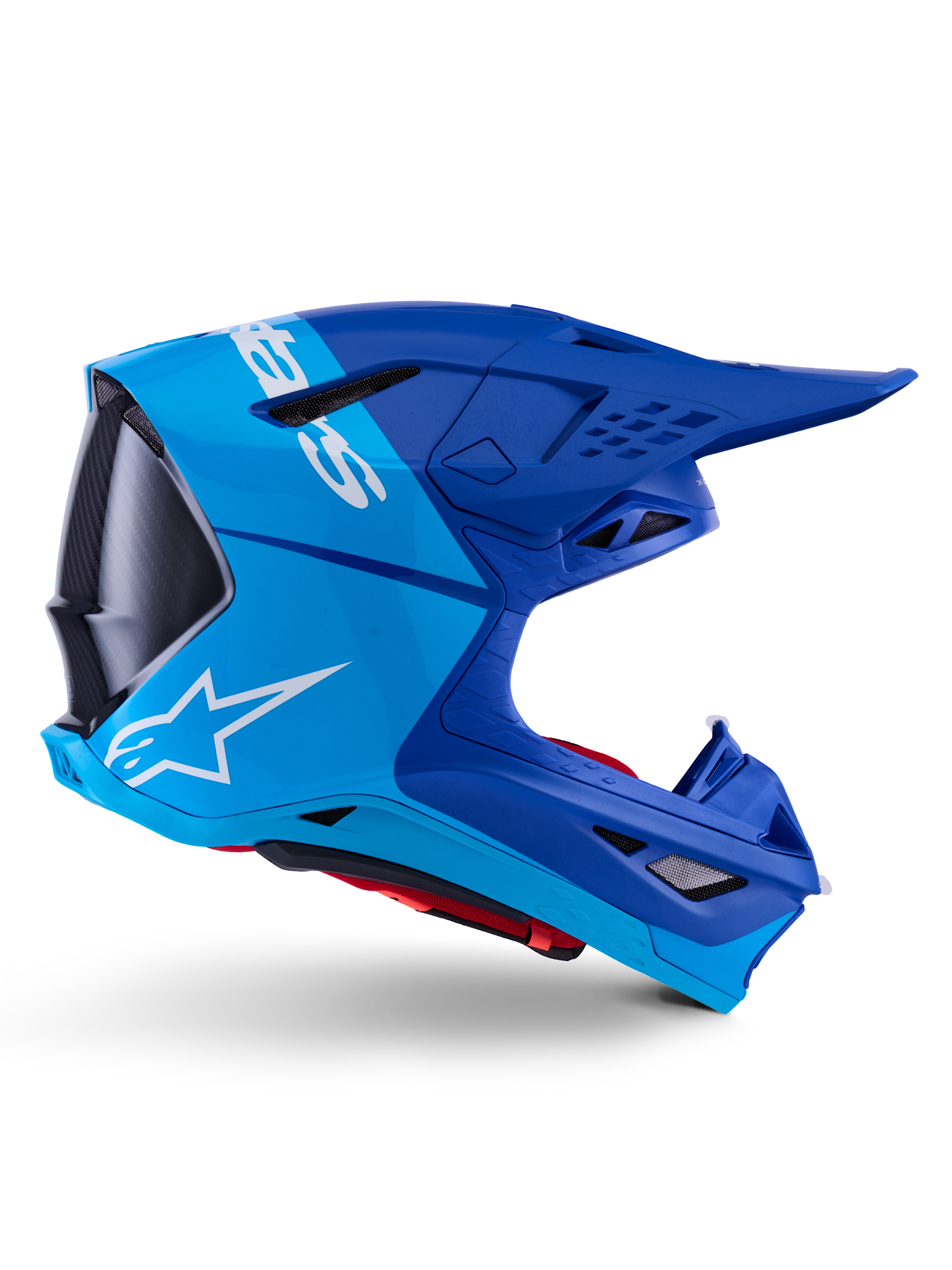Alpinestars Supertech M10 Flood Helmet, Motocross Helmet, Metallic and Medium Blue with Black Carbon accents, side profile view, featuring a white logo, aerodynamic design with ventilation ports, carbon fiber texture details, professional off-road racing protection