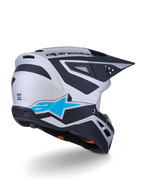 Alpinestars S-M3 Heat-hjälm ECE 22.06, motocrosshjälm, silver, blå och matt svart, vy bakifrån med stor blå stjärnlogotyp och svarta vinklade mönster, aerodynamiskt skal med ventilationsöppningar, högpresterande skydd för terrängkörning