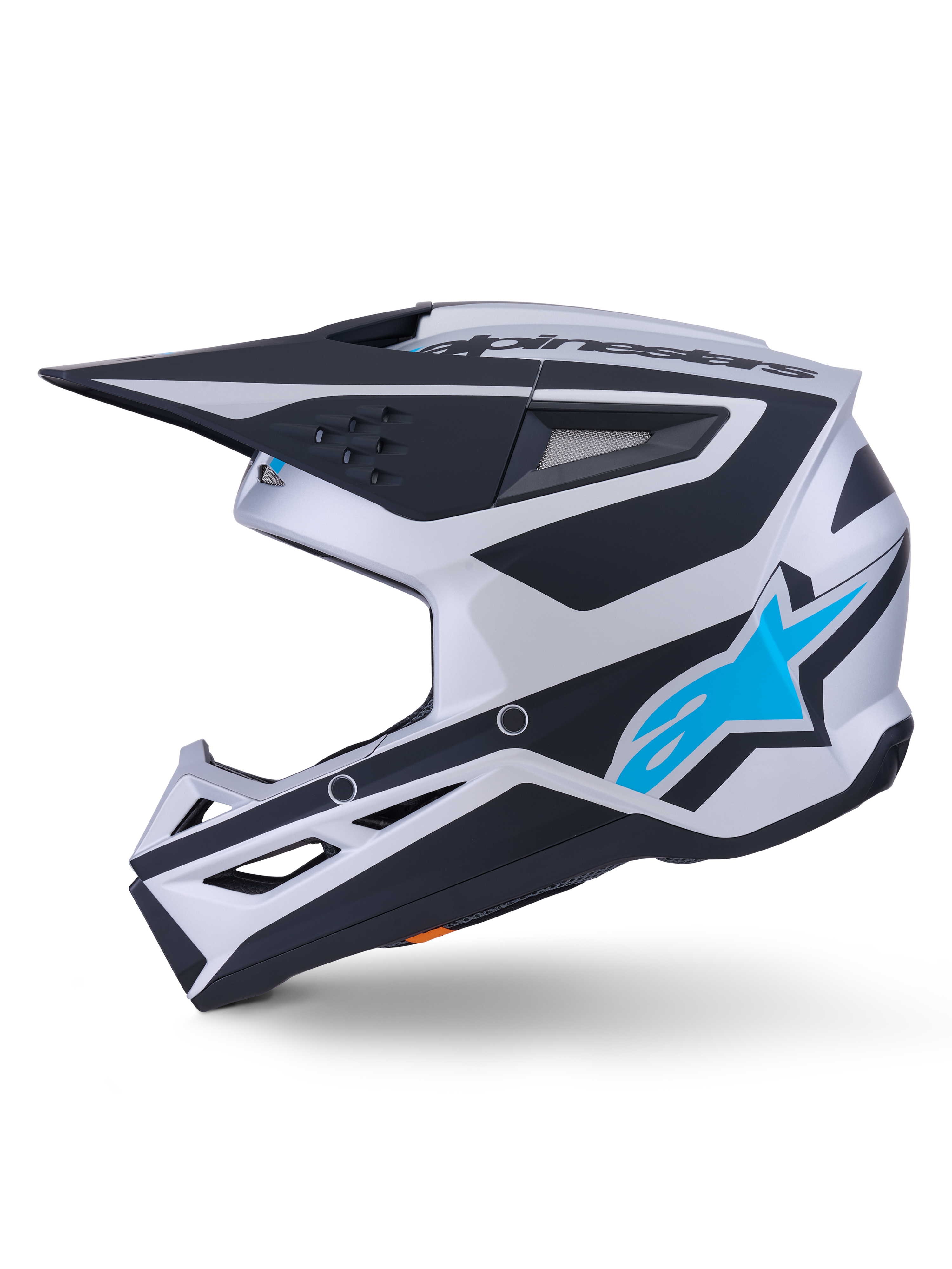 Alpinestars S-M3 Heat-hjälm ECE 22.06, motocrosshjälm, silver, blå och svart matt finish, sidoprofil, med en klarblå Alpinestars-stjärnlogotyp, svart visir och flera ventilationsportar, aggressiv aerodynamisk design för terrängkörning