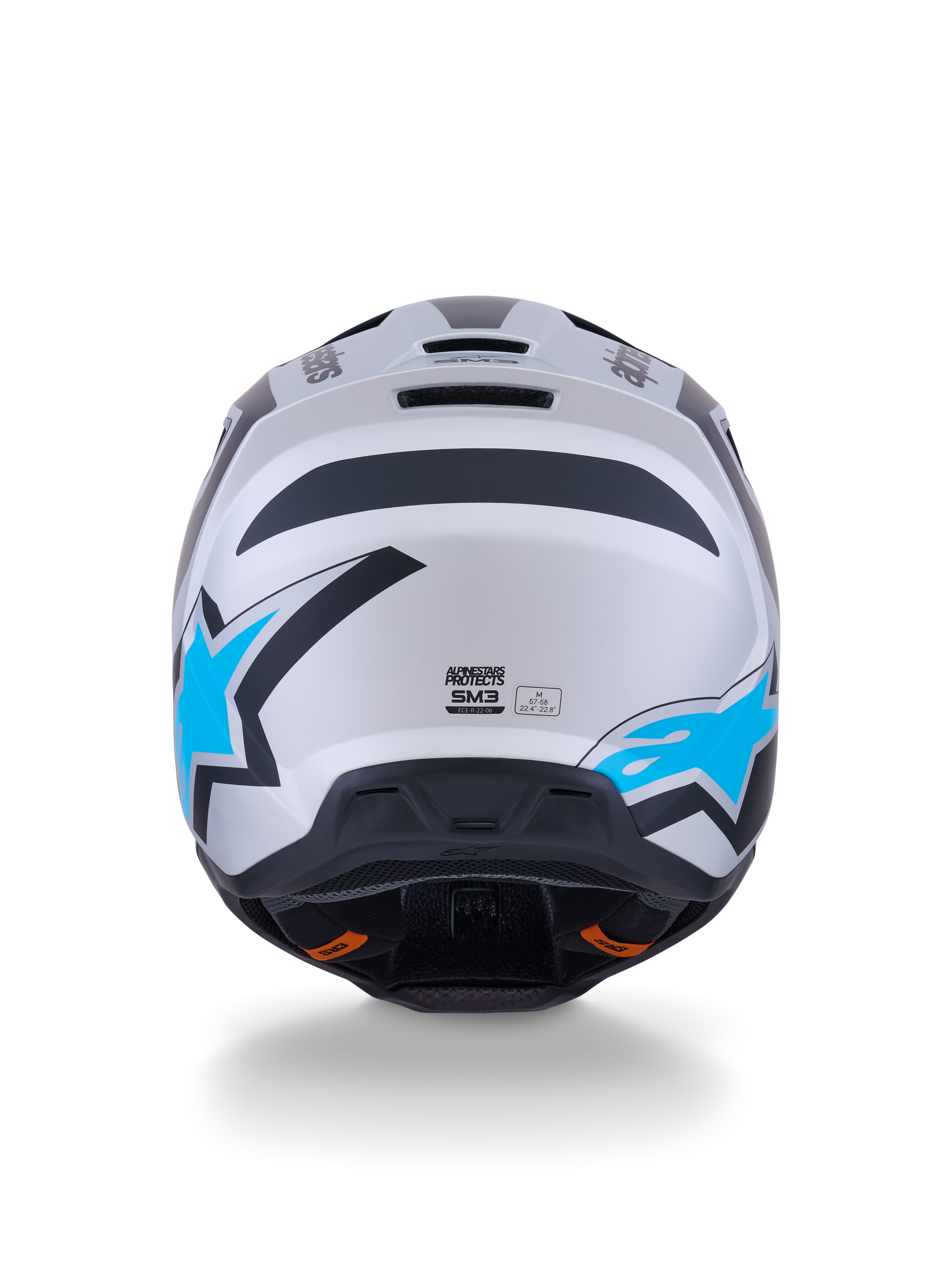 Alpinestars S-M3 Heat hjälm, motocrosshjälm, silver, blå och matt svart, vy bakifrån som visar klarblå stjärnlogotyper, matt finish och integrerade ventilationsportar.