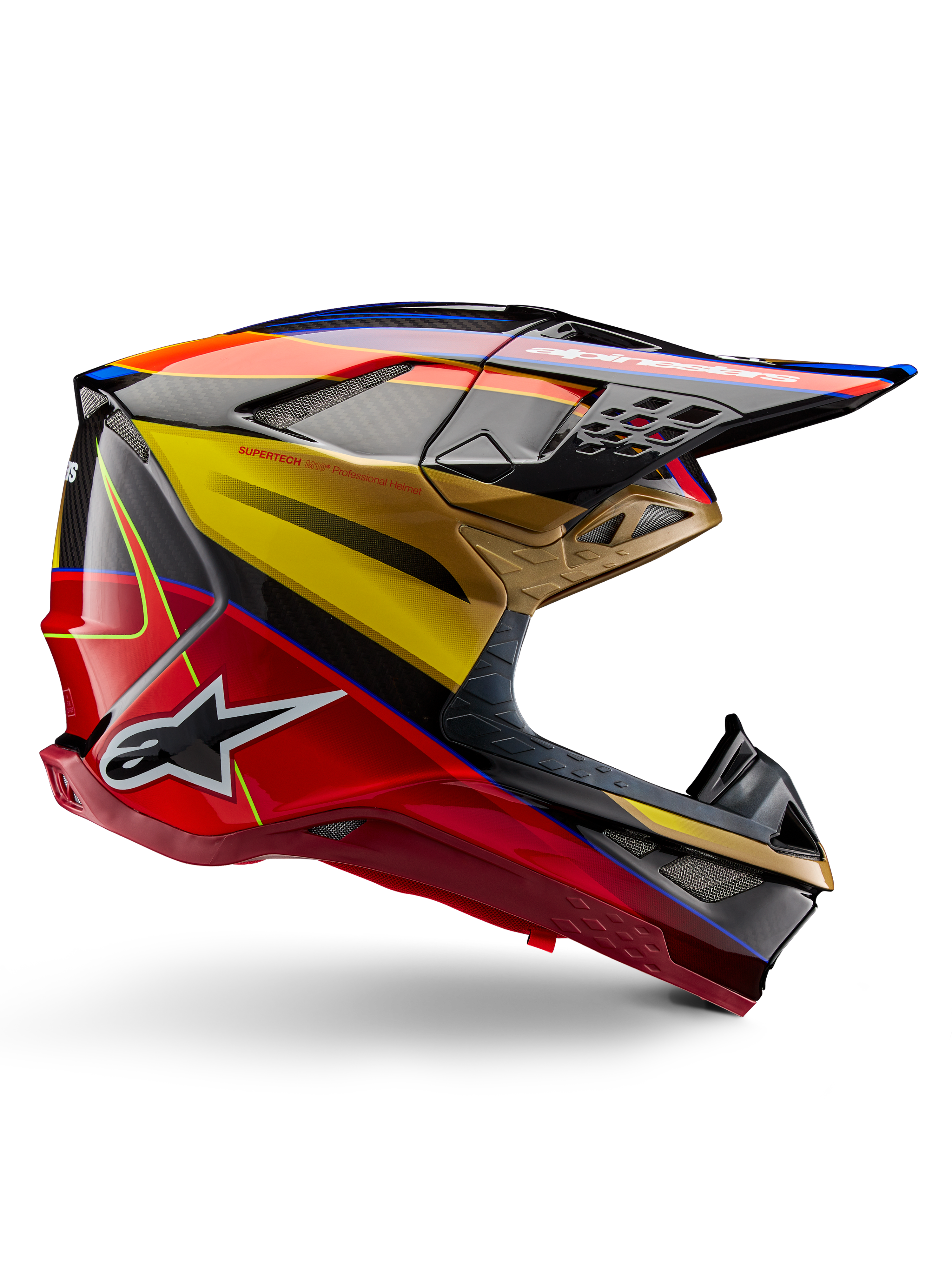 Alpinestars Supertech M10 Era hjälm, motocrosshjälm, blank guldgul och Rio-röd med blå och svarta detaljer, aerodynamisk design med integrerad skärm, flera nättäckta ventilationsöppningar och kolfiberdetaljer, ECE 22.06-certifierad