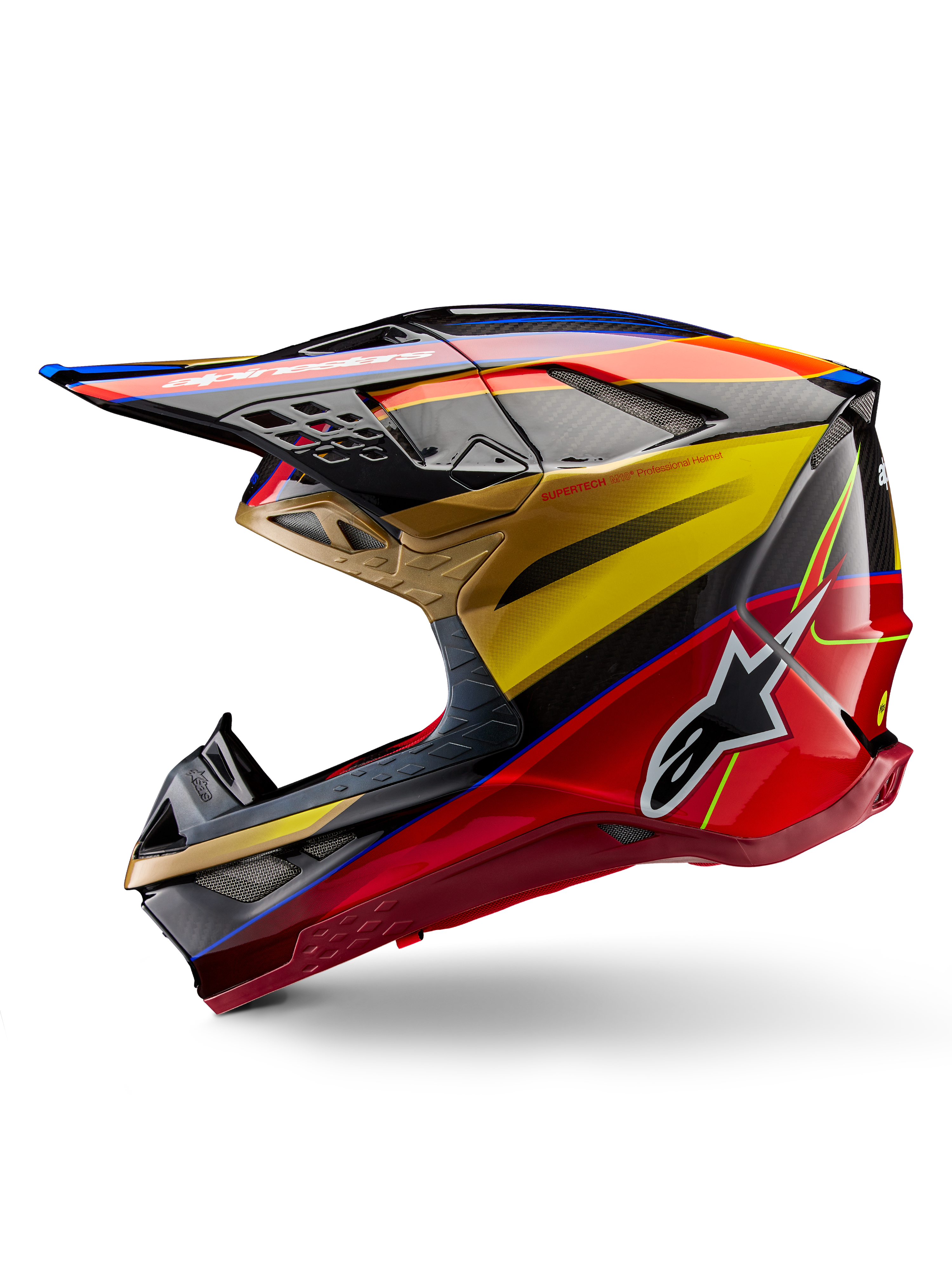 Alpinestars Supertech M10 Era hjälm, motocrosshjälm, guld, gul och Rio Red glansig finish, sidoprofil med kolfiberstruktur och djärv grafik, Alpinestars stjärnlogotyp, aerodynamisk form med flera ventilationsöppningar, professionellt skydd för terrängkörning