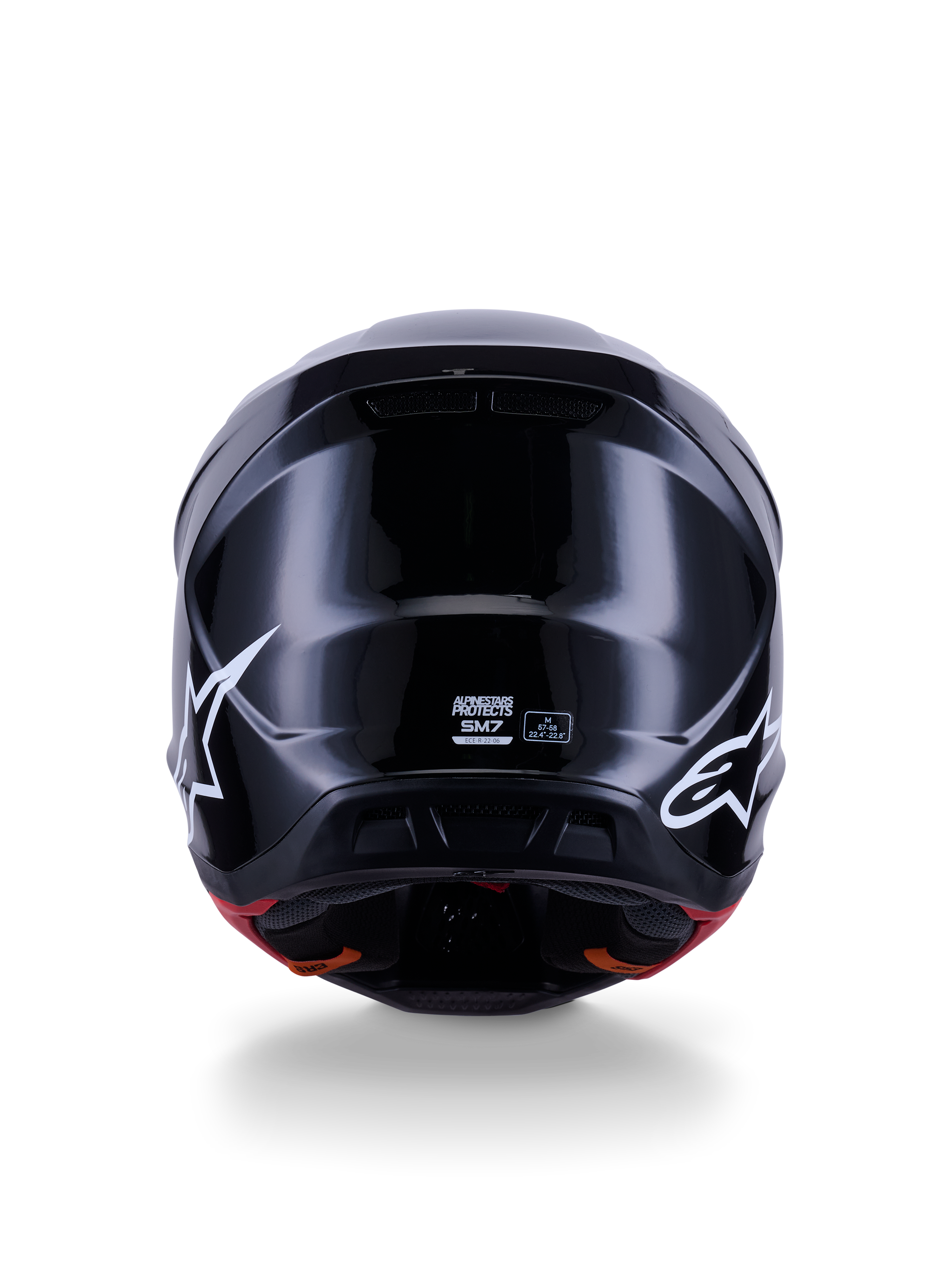 Alpinestars S-M7 Solid-hjälm ECE 22.06, motocrosshjälm, blanksvart, baksida med vita stjärnlogotyper, aerodynamiskt kompositskal med högblank yta, säkerhetscertifiering och storleksetiketter i mitten