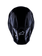Alpinestars S-M7 Solid-hjälm ECE 22.06, motocrosshjälm, blanksvart, vy uppifrån som visar det aerodynamiska kompositskalet med Astars-logotyp och M7-branding, strömlinjeformad design med ventilationsöppningar för offroad-racingprestanda