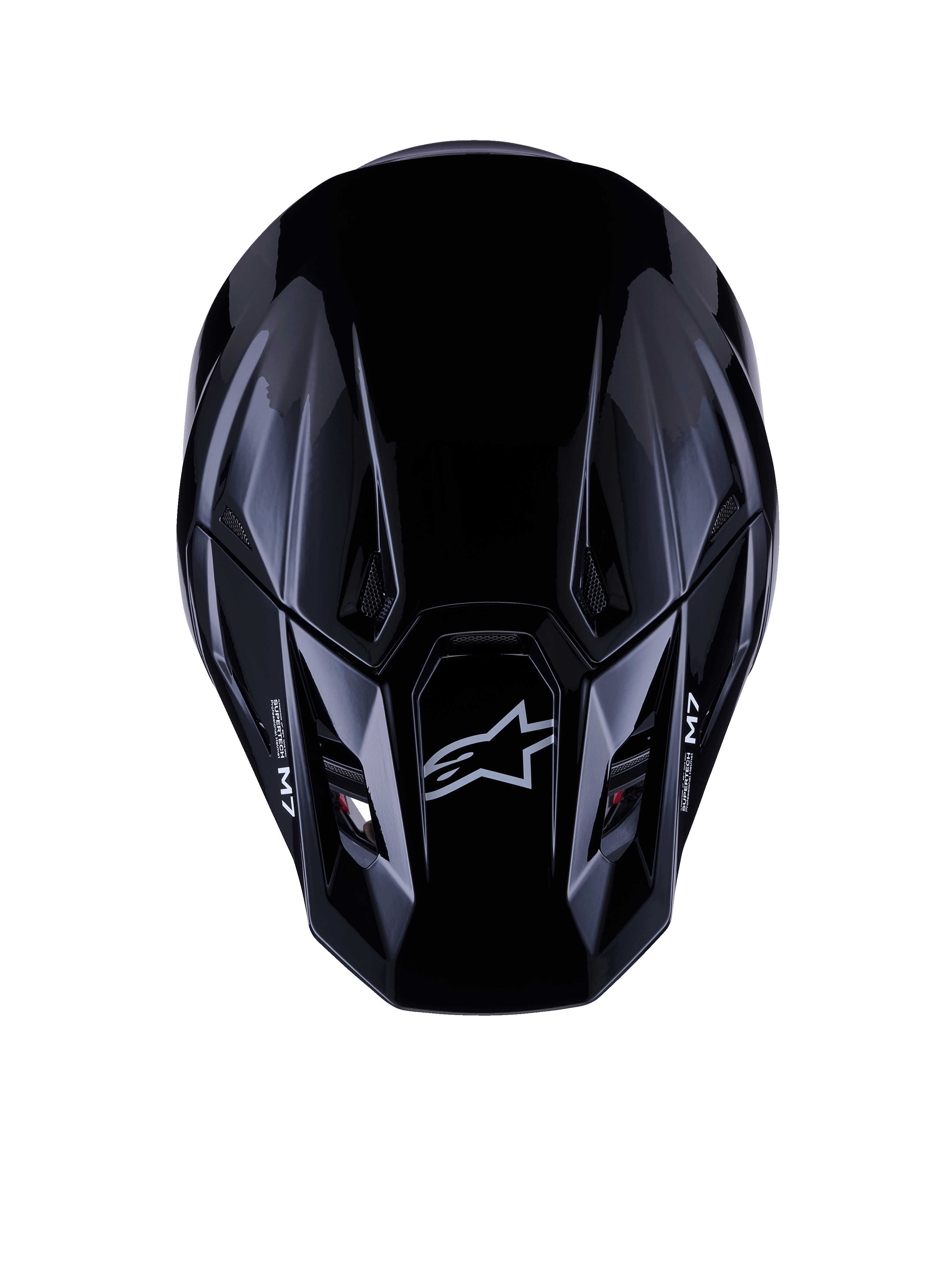 Alpinestars S-M7 Solid-hjälm ECE 22.06, motocrosshjälm, blanksvart, vy uppifrån som visar det aerodynamiska kompositskalet med Astars-logotyp och M7-branding, strömlinjeformad design med ventilationsöppningar för offroad-racingprestanda