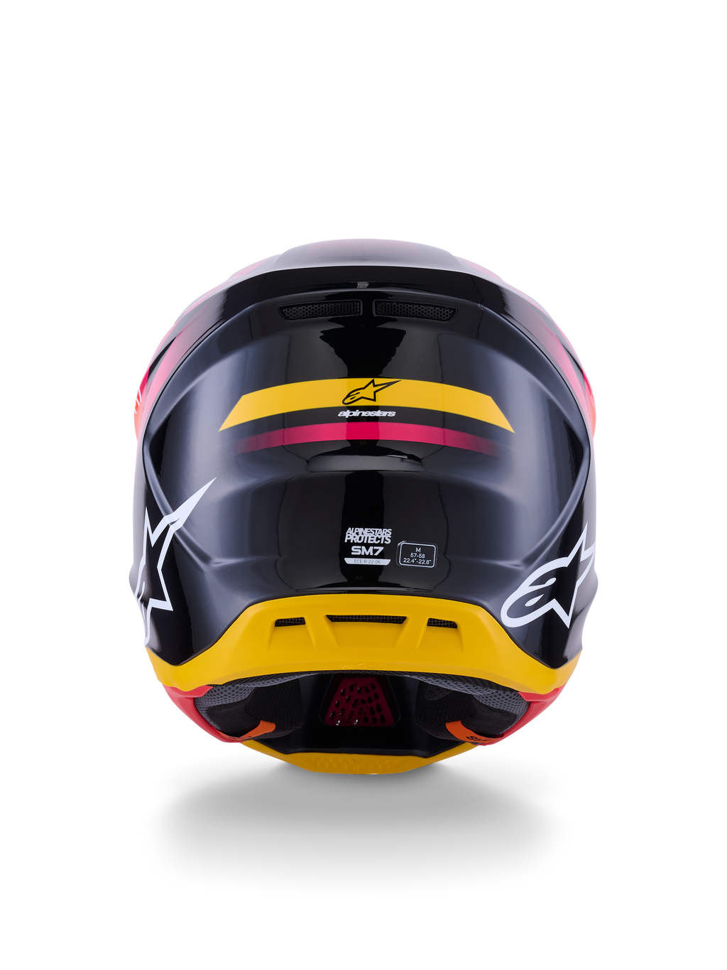 Alpinestars S-M7 Rise-hjälm ECE 22.06, motocrosshjälm, vy bakifrån, glansigt svart med gula och rosa accenter, stora vita logotyper på sidorna, aerodynamiskt kompositskal, racingutrustning för terrängkörning