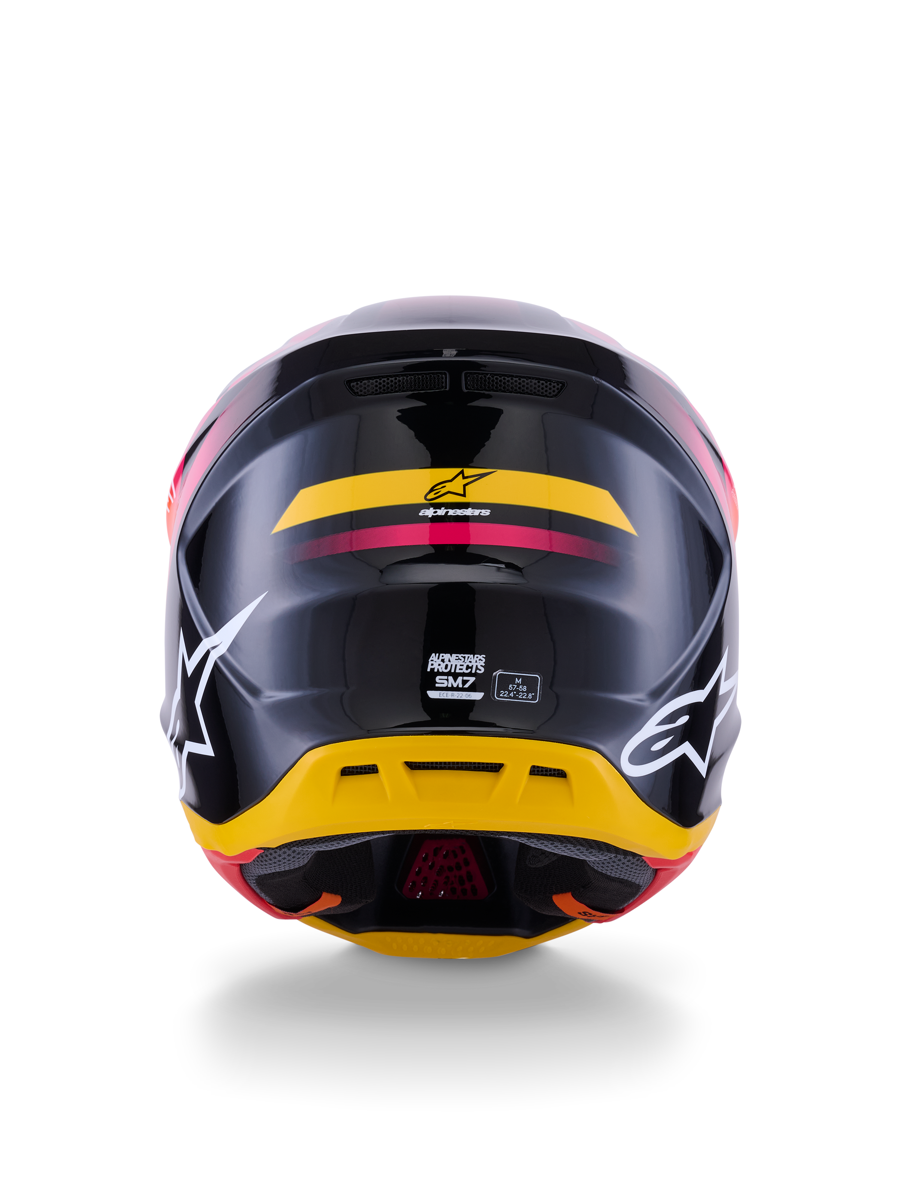 Alpinestars S-M7 Rise-hjälm ECE 22.06, motocrosshjälm, vy bakifrån, glansigt svart med gula och rosa accenter, stora vita logotyper på sidorna, aerodynamiskt kompositskal, racingutrustning för terrängkörning
