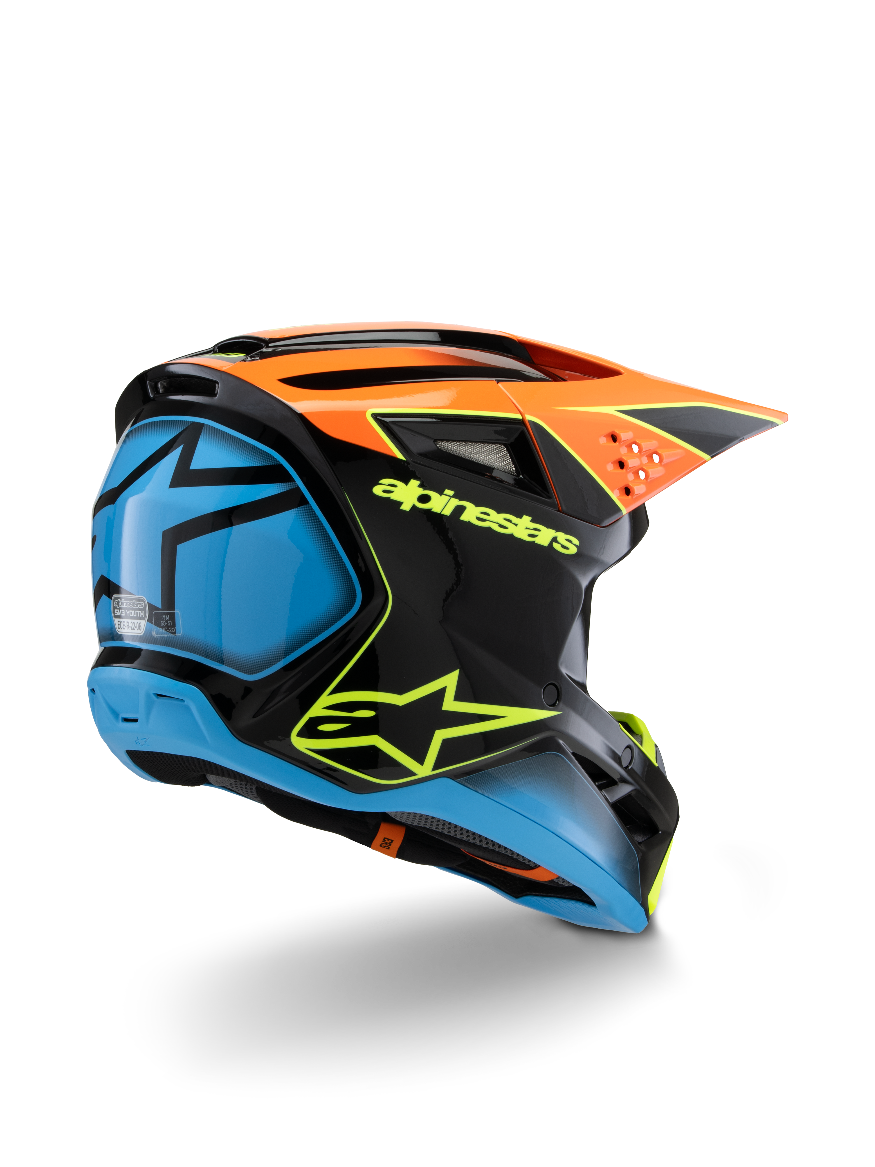 Alpinestars S-M3 Youth Fray-hjälm, motocrosshjälm, svart, orange och blå med neongula detaljer, vy snett bakifrån som visar tydlig Alpinestars-logotyp och stjärnsymbol, strömlinjeformad aerodynamisk design för offroad-racing för ungdomar